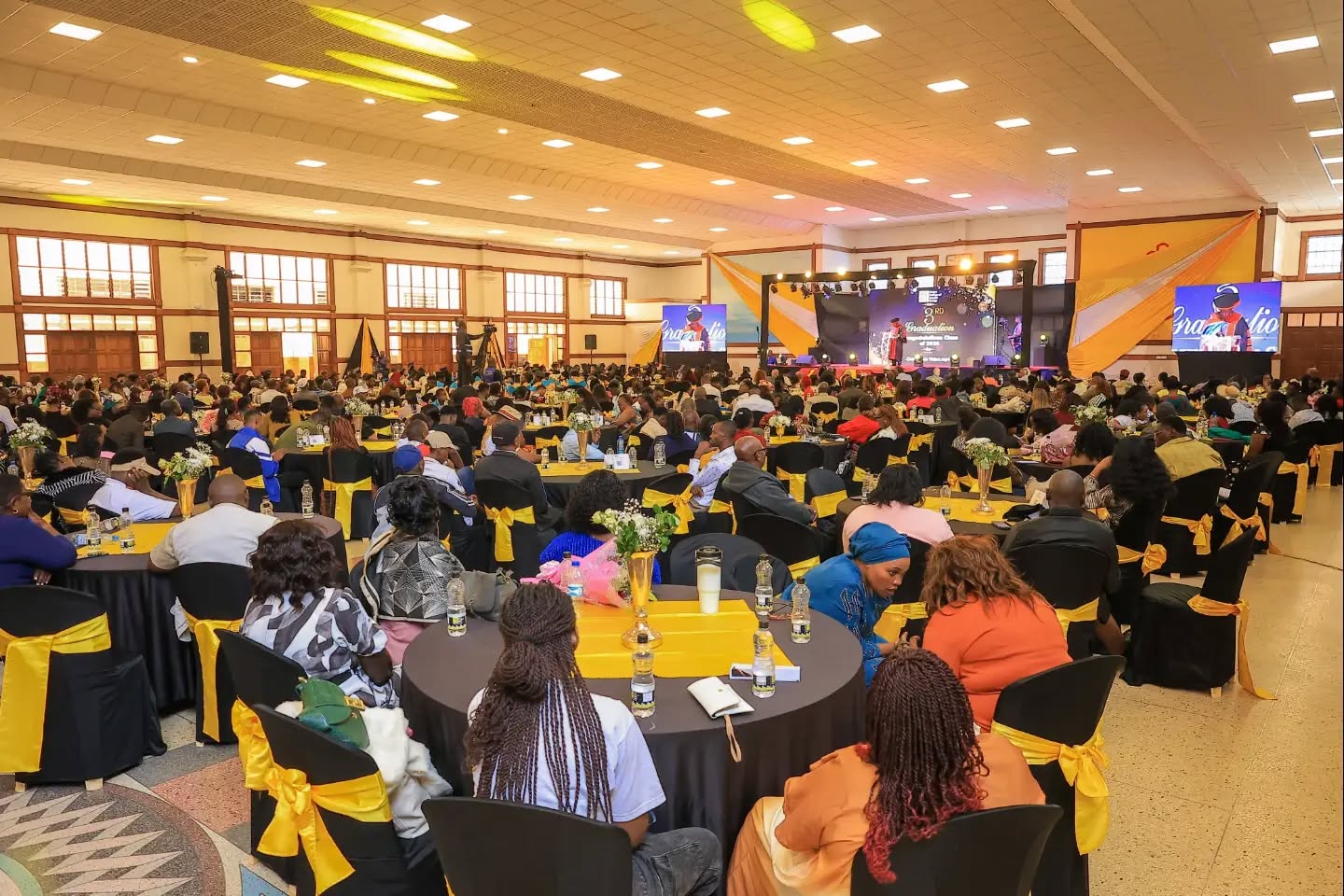 Guests gathered at a KENCID graduation banquet